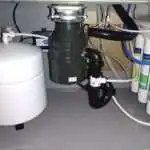 Donnie’s Plumbing technician replacing garbage disposal in Murrieta kitchen