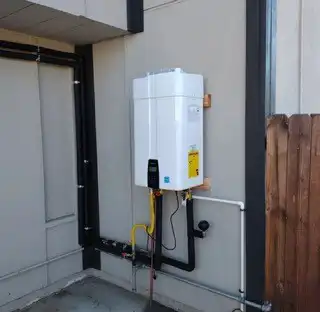 Wall-mounted tankless water heater installation for a local homeowner
